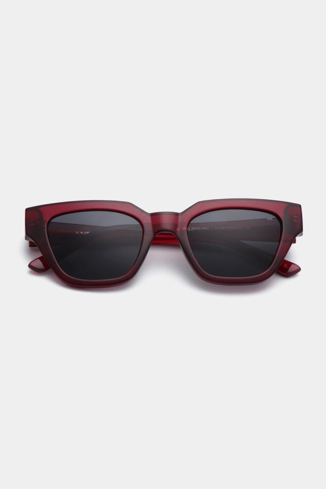 SONNENBRILLE KAWS BURGUNDY TRANSPARENT